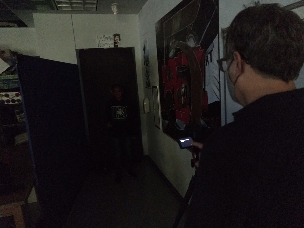 Student testing out light painting with guest speakers. 